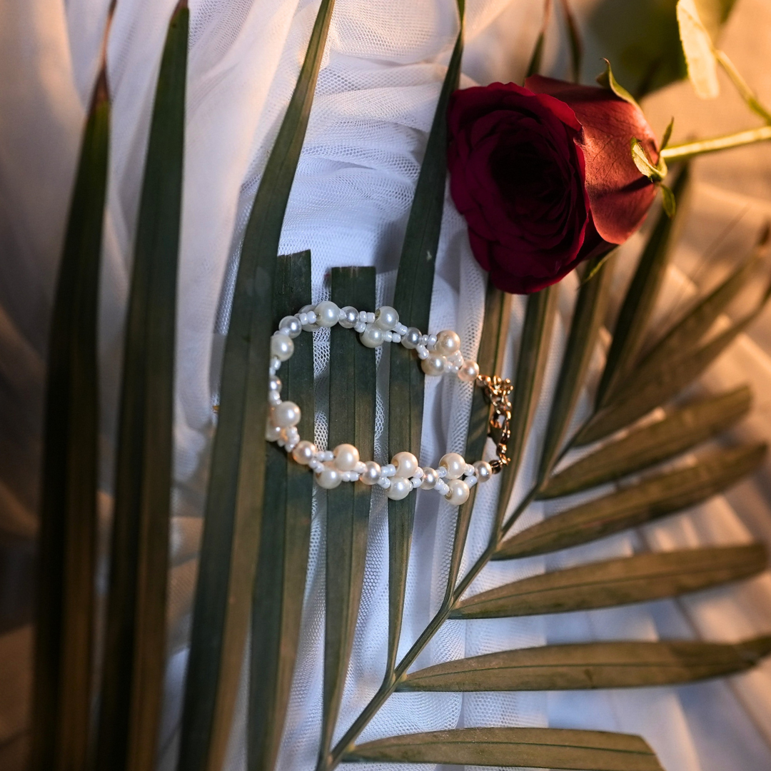 Pearl Serpent Elegance Bracelet – Snake Design with White Glass & Crisscross Beads