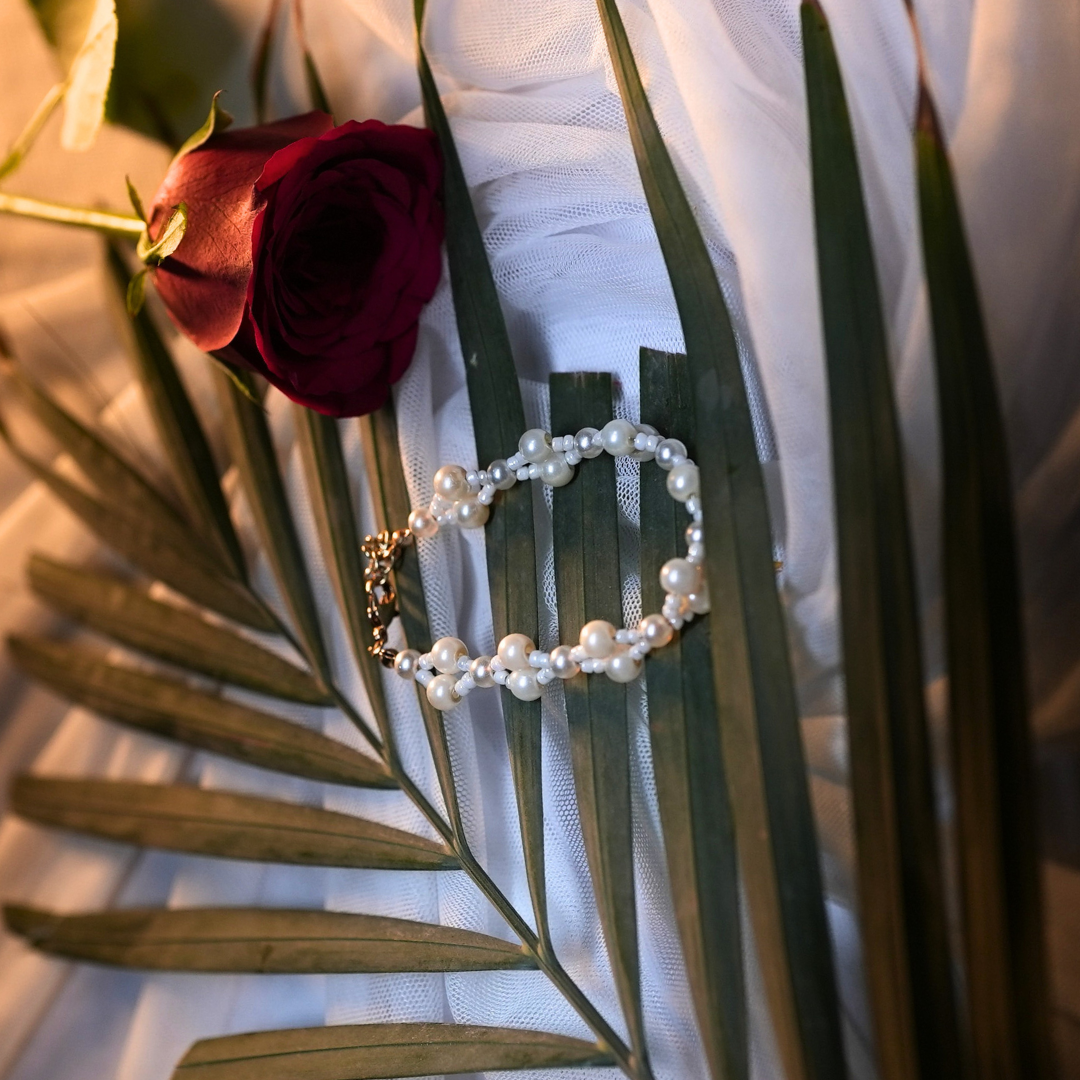 Pearl Serpent Elegance Bracelet – Snake Design with White Glass & Crisscross Beads